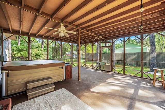 sunroom / solarium featuring ceiling fan