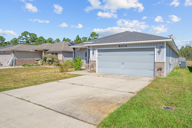 ranch-style house with central air condition unit, a front lawn, and a garage