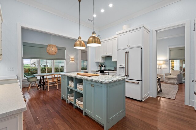 kitchen featuring ornamental molding, decorative light fixtures, a kitchen island, dark wood-type flooring, and high end white refrigerator