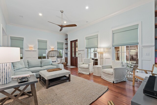 living room with a wealth of natural light, ceiling fan, and wood-type flooring