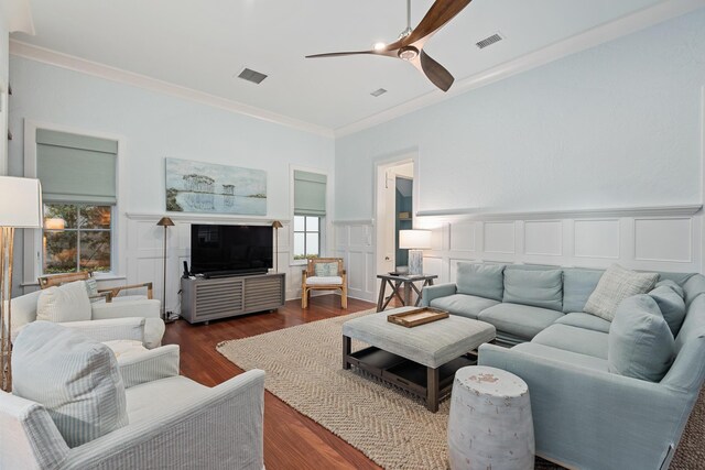 living room with crown molding, a healthy amount of sunlight, ceiling fan, and hardwood / wood-style floors