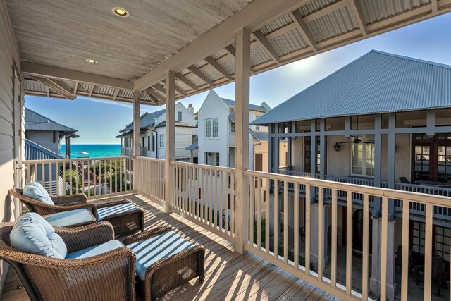 balcony featuring a water view