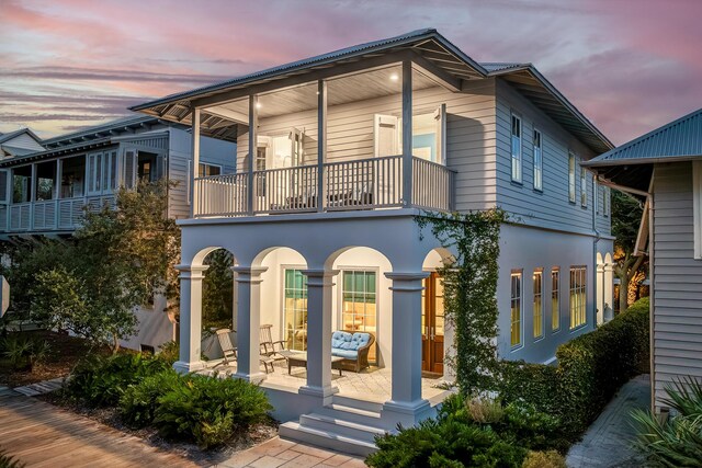 exterior space featuring a balcony and a patio