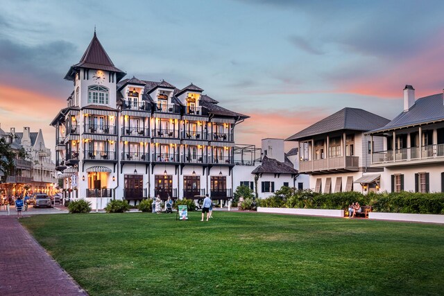 view of outdoor building at dusk