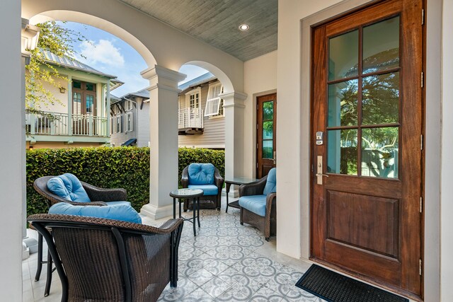 view of patio featuring a balcony and outdoor lounge area