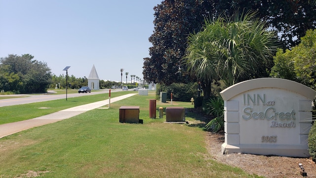 view of home's community with a lawn