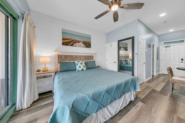 bedroom with hardwood / wood-style floors and ceiling fan