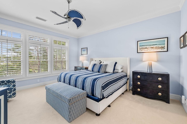 carpeted bedroom featuring multiple windows, ceiling fan, and ornamental molding