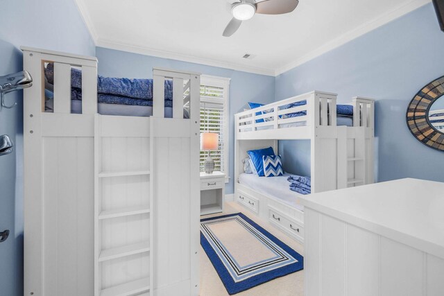 bedroom featuring ceiling fan and crown molding