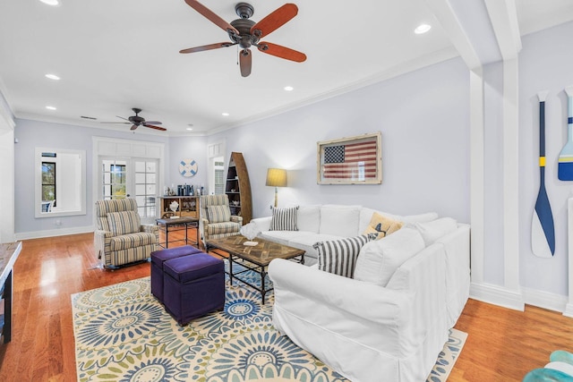 living room featuring french doors, light hardwood / wood-style flooring, ceiling fan, and ornamental molding