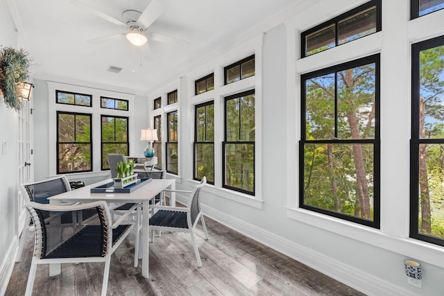 sunroom / solarium with ceiling fan