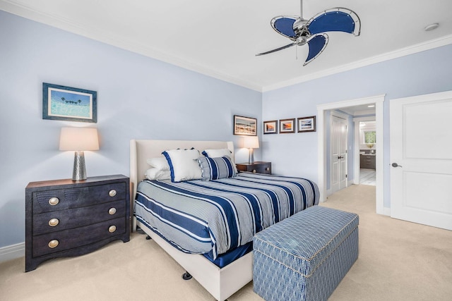 bedroom with ceiling fan, ensuite bathroom, light carpet, and ornamental molding