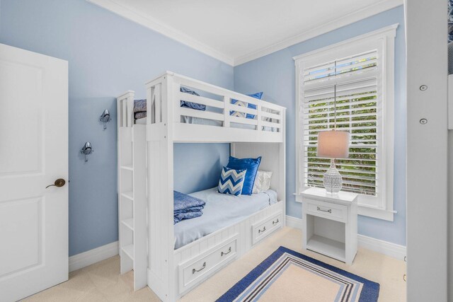 carpeted bedroom with crown molding