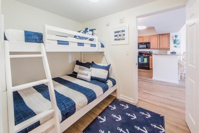 bedroom featuring hardwood / wood-style flooring