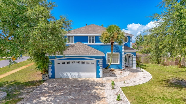 view of front facade with a garage and a front yard