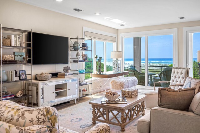 living room with a wealth of natural light and hardwood / wood-style floors