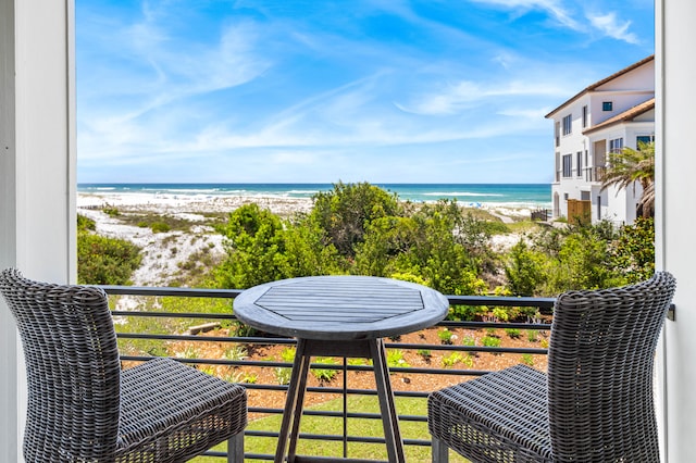 balcony with a view of the beach and a water view