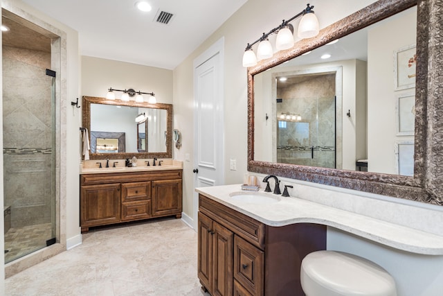 bathroom with vanity, toilet, and an enclosed shower