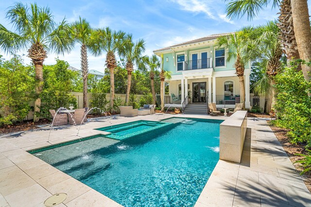 view of swimming pool featuring a patio area and pool water feature