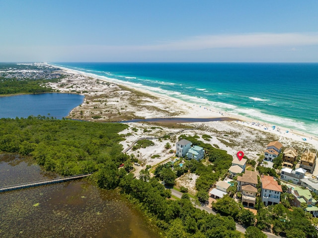 aerial view featuring a view of the beach and a water view