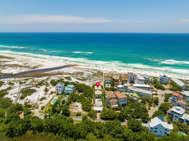 aerial view featuring a view of the beach and a water view