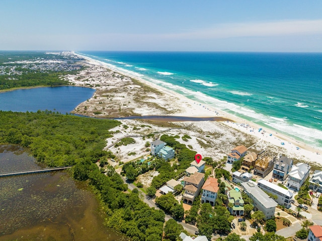bird's eye view with a view of the beach and a water view