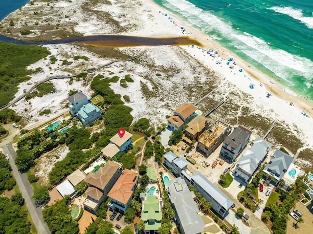 aerial view featuring a residential view, a water view, and a view of the beach