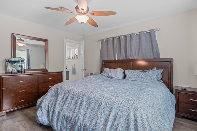 bedroom featuring ceiling fan and dark hardwood / wood-style floors