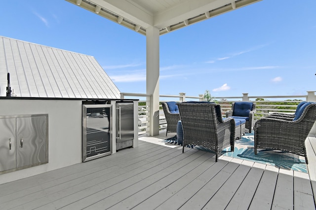 wooden deck featuring an outdoor hangout area and wine cooler