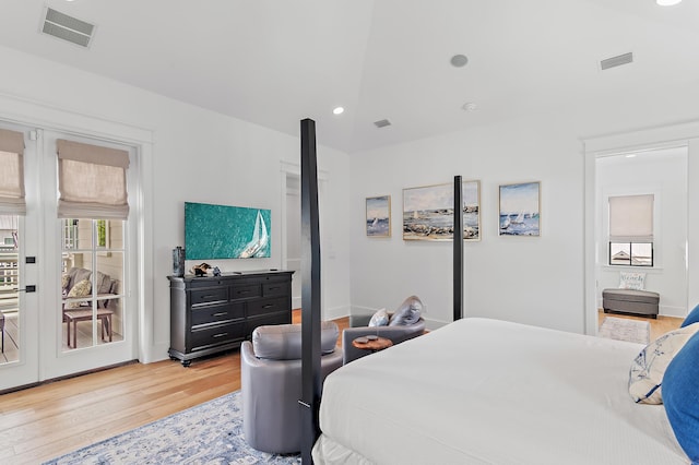 bedroom featuring light hardwood / wood-style flooring and access to exterior