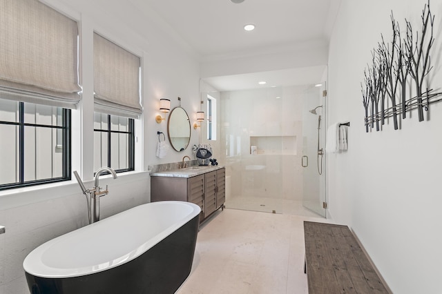 bathroom featuring tile patterned flooring, shower with separate bathtub, ornamental molding, and vanity