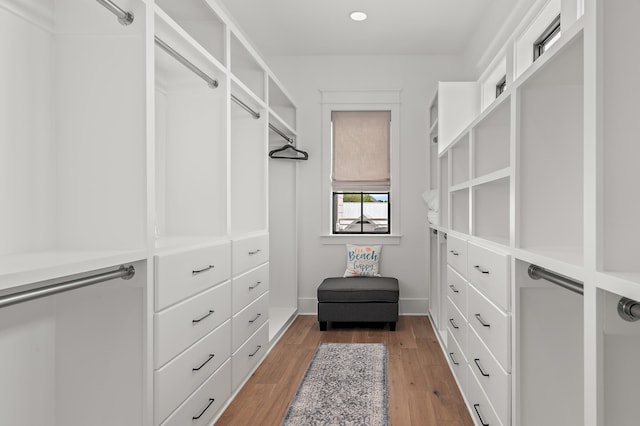 walk in closet featuring light hardwood / wood-style flooring