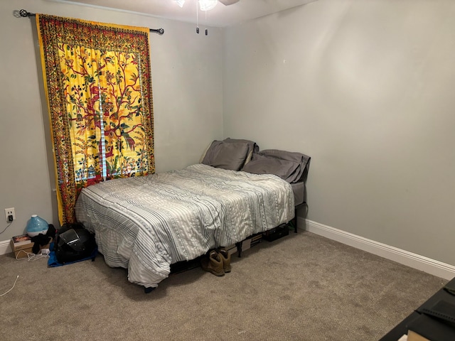 bedroom with ceiling fan and carpet floors