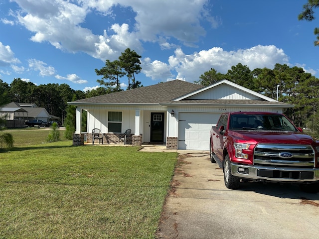 view of front of house with a garage, a porch, and a front lawn