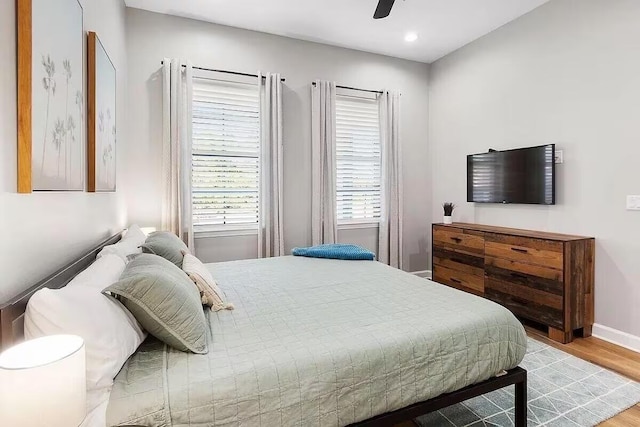 bedroom featuring hardwood / wood-style floors and ceiling fan