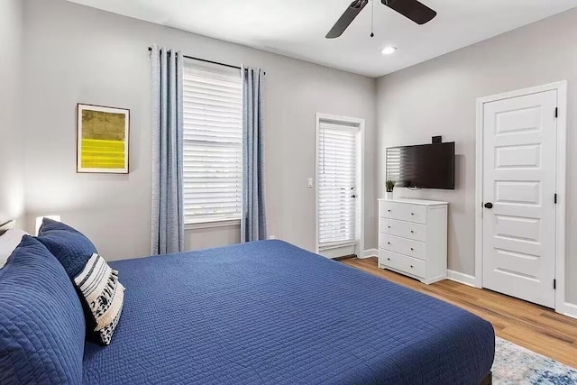 bedroom featuring light hardwood / wood-style flooring and ceiling fan