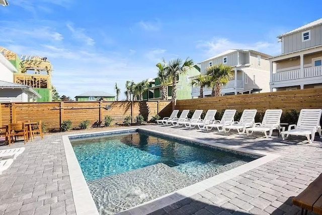 view of swimming pool with a patio area