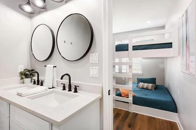 bathroom with vanity and hardwood / wood-style flooring