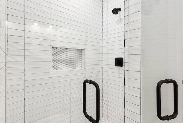 details with a shower with shower door