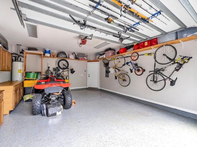 garage with gas water heater and baseboards