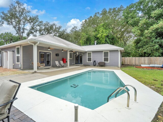 view of pool with ceiling fan and a patio area