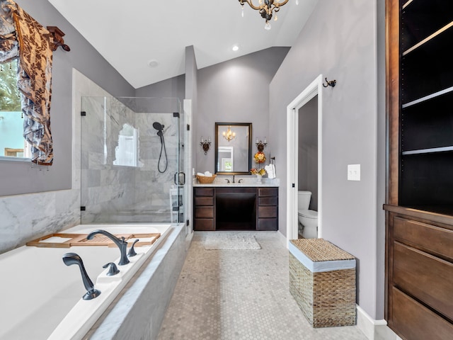 full bathroom with a garden tub, toilet, a shower stall, vanity, and vaulted ceiling