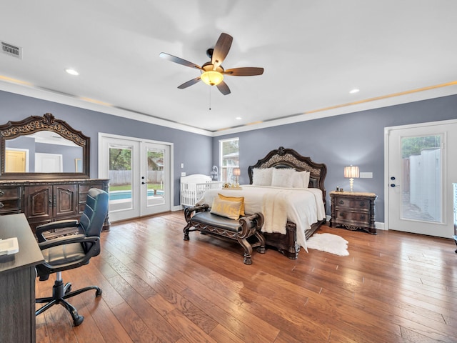 bedroom featuring visible vents, baseboards, french doors, wood-type flooring, and access to outside