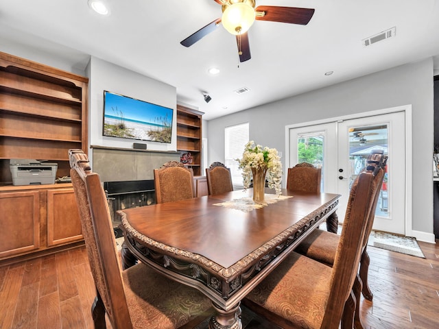 dining room with recessed lighting, french doors, visible vents, and wood-type flooring