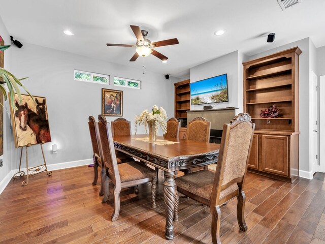 dining room with recessed lighting, baseboards, and wood finished floors