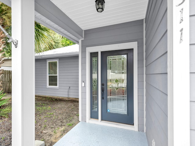 entrance to property featuring metal roof