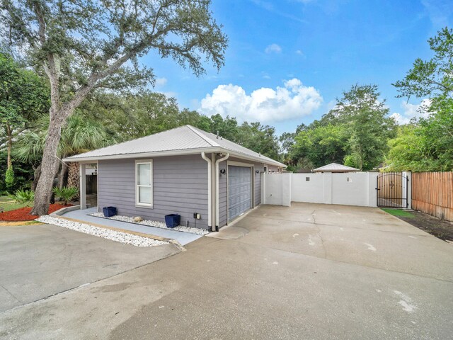 view of side of home with a garage