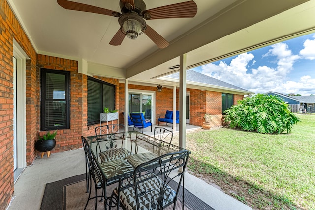 view of patio / terrace featuring ceiling fan