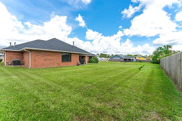 view of yard featuring central AC