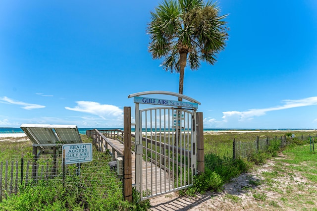 view of yard with a view of the beach and a water view